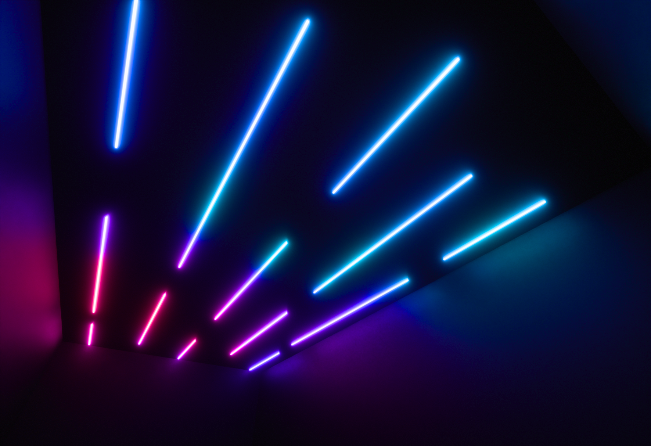 Angled view of Stratus light rows across a room ceiling