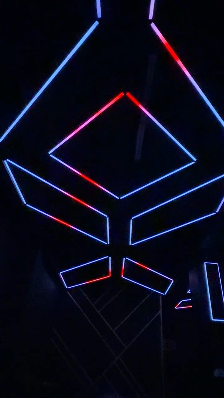 Red and blue light tracing angular ceiling fixtures at Havoc