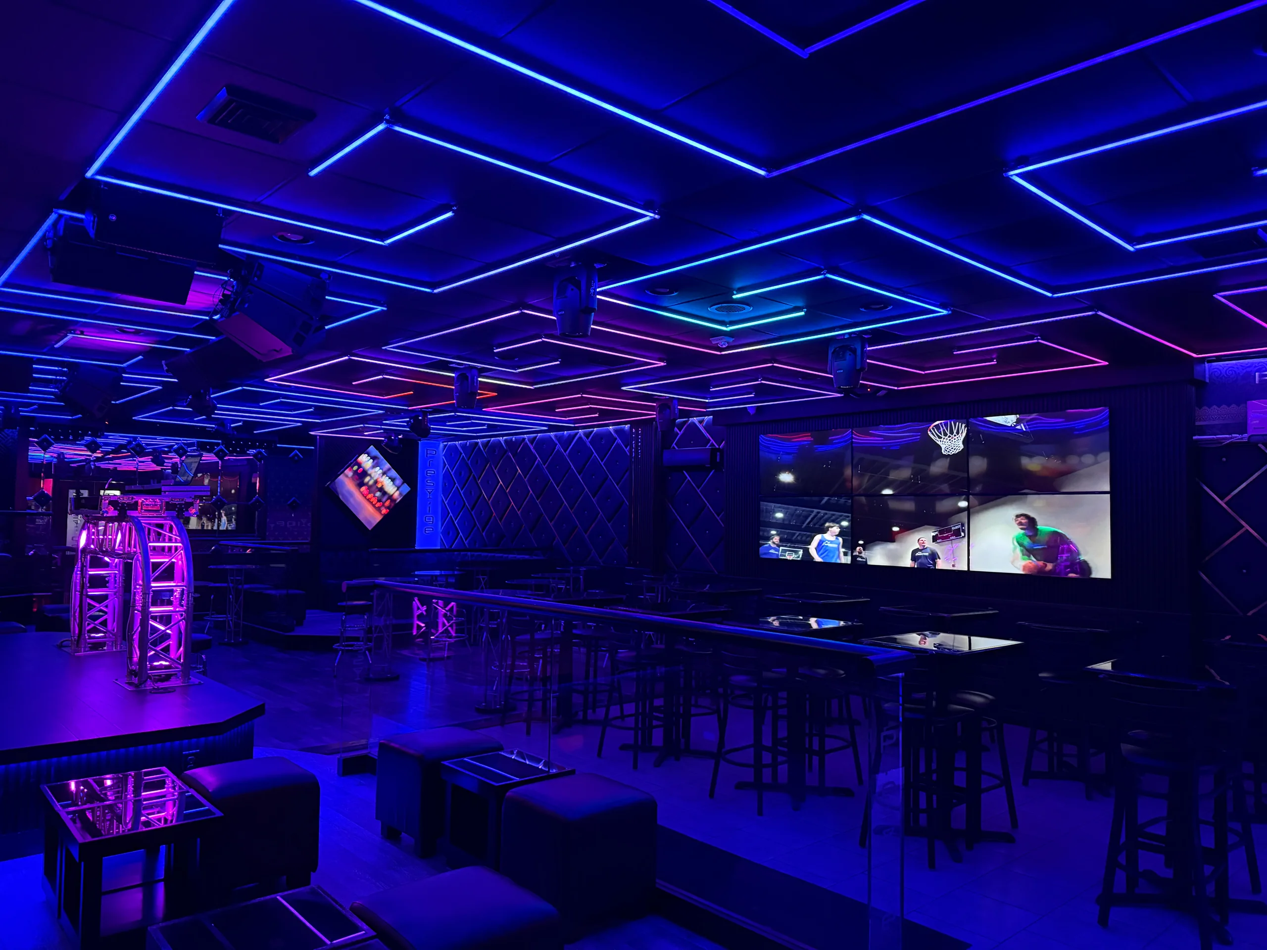 Blue, cyan and pink geometric LED ceiling lighting above the seating and stage at Prestige in Hazleton, PA